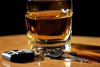 Glass of alcohol on a table - Bakersfield felony DUI attorney